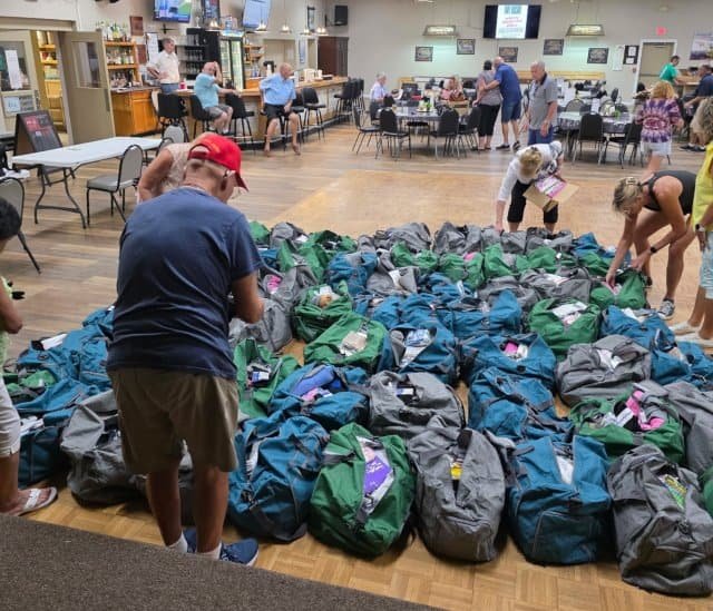 Backpacks collection event at Elks Lodge 2582, supporting community charity initiatives.